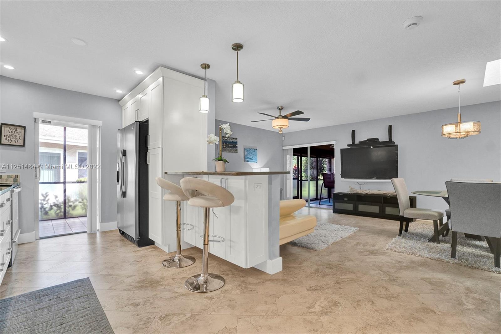 Whisper Walk Boca Raton, FL 33496 - Photo 4 of 17 a living room with furniture and a flat screen tv