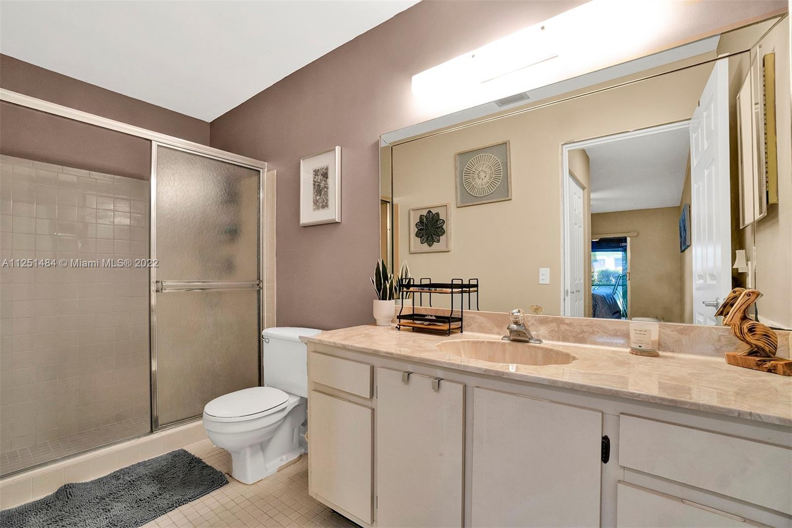 Whisper Walk Boca Raton, FL 33496 - Photo 6 of 17 a bathroom with a sink a toilet and shower