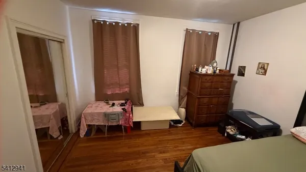 a room with furniture and wooden floor