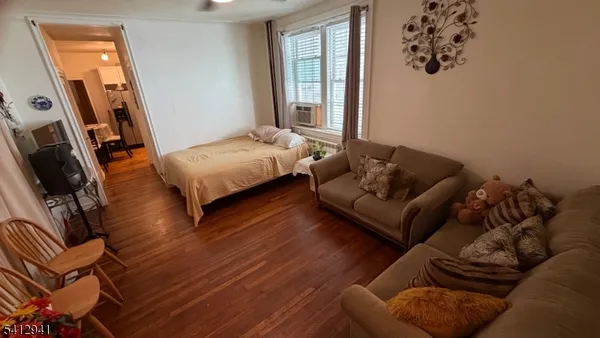 a living room with furniture rug and window