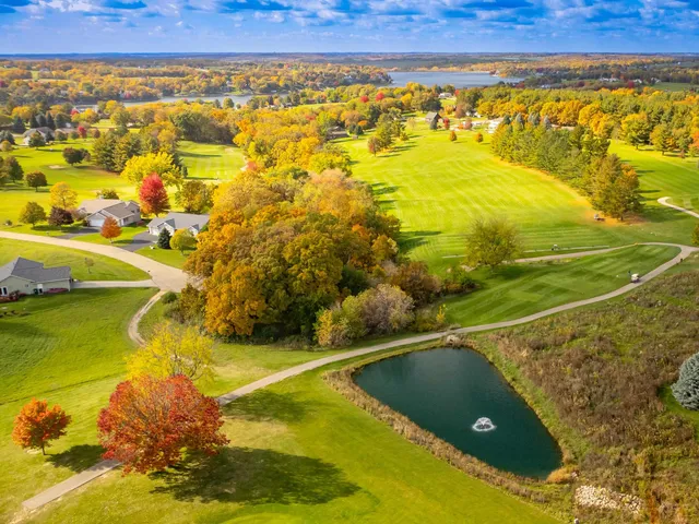 a view of a golf course with a lake
