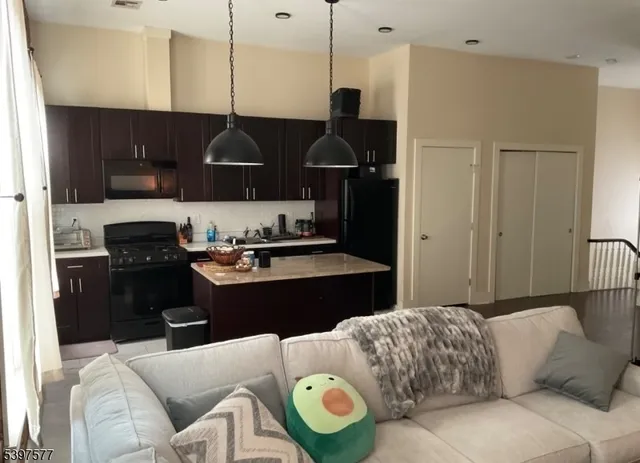 a living room with a couch and a stove