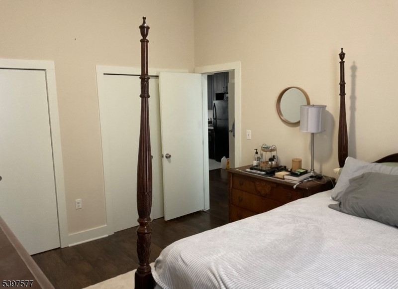 518 South Main Street, Unit 6 Phillipsburg, NJ 08865 - Photo 10 of 10 a bedroom with a bed and wooden floor