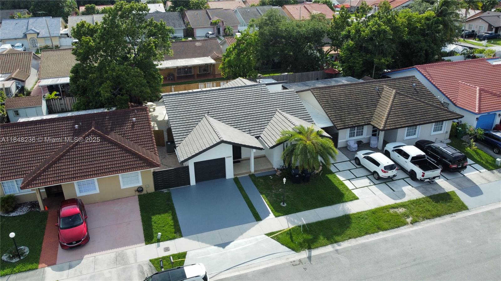 15882 Southwest 138th Court Miami, FL 33177 - Photo 3 of 11 an aerial view of a house with garden space and sitting area