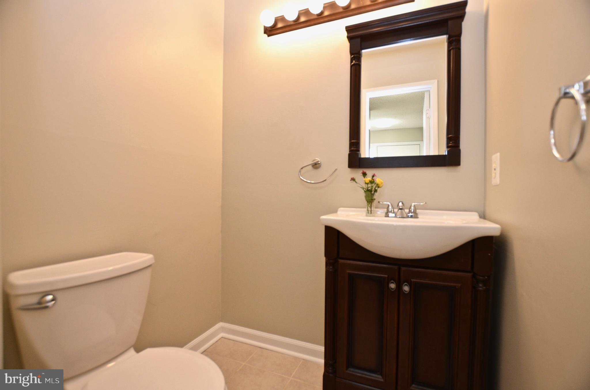12136 Captiva Court Reston, VA 20191 - Photo 12 of 26 REMODELED HALF BATH W/NEW VANITY, MIRROR & LIGHT