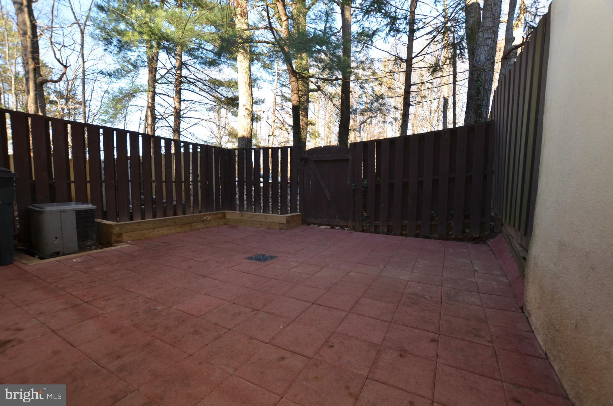 12136 Captiva Court Reston, VA 20191 - Photo 22 of 26 FENCED WITH A GATE AND WOOD BORDER PLANTING AREA
