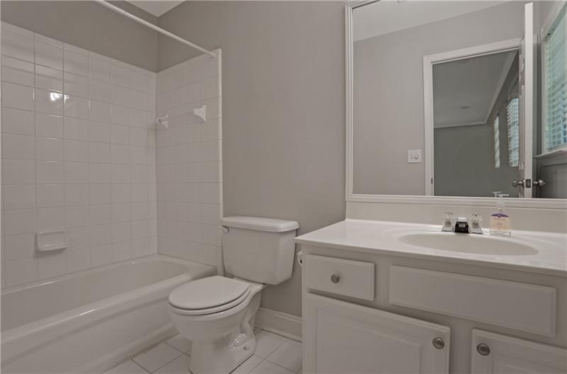 1494 Lavista Proper Circle Decatur, GA 30033 - Photo 24 of 25 a bathroom with a sink toilet and shower