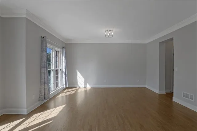 a view of a livingroom with wooden floor