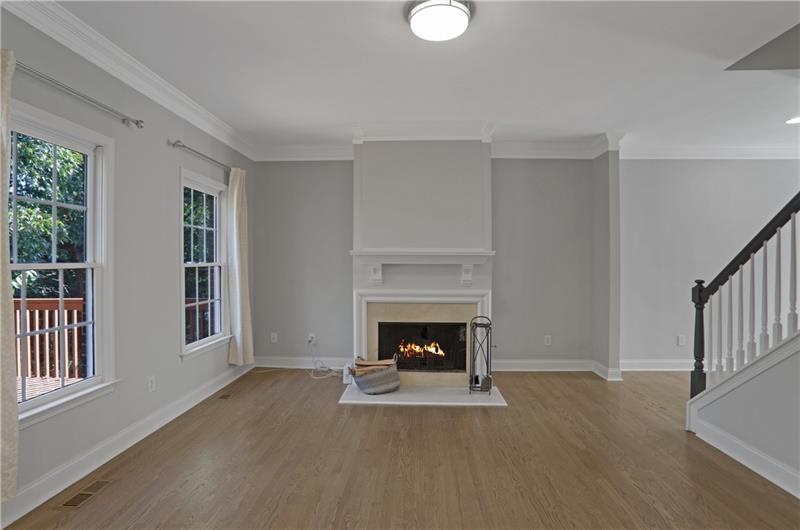 1494 Lavista Proper Circle Decatur, GA 30033 - Photo 5 of 25 a living room with furniture and a fireplace
