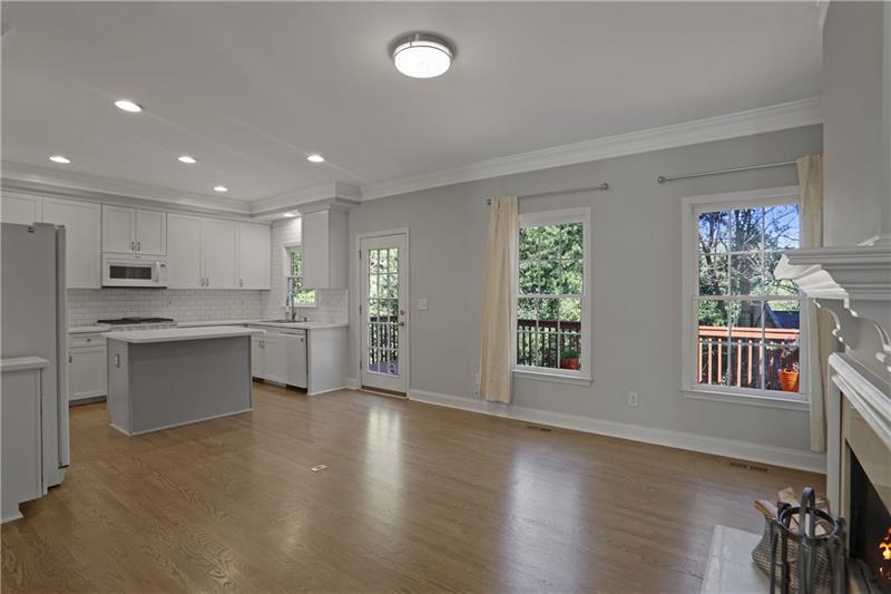 1494 Lavista Proper Circle Decatur, GA 30033 - Photo 7 of 25 a open kitchen with white cabinets and wooden floor