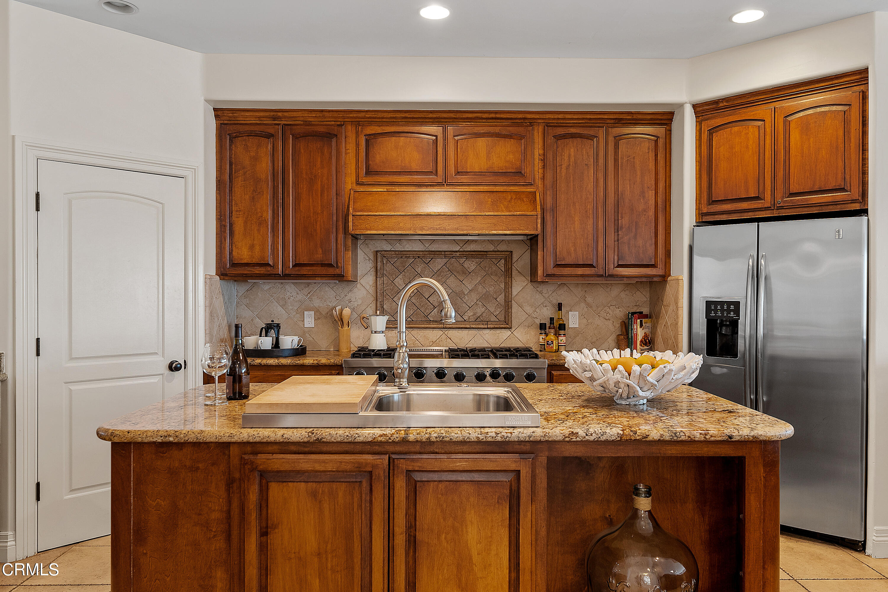 1065 Mandalay Beach Road Oxnard, CA 93035 - Photo 11 of 36 a kitchen with granite countertop a sink stove and refrigerator
