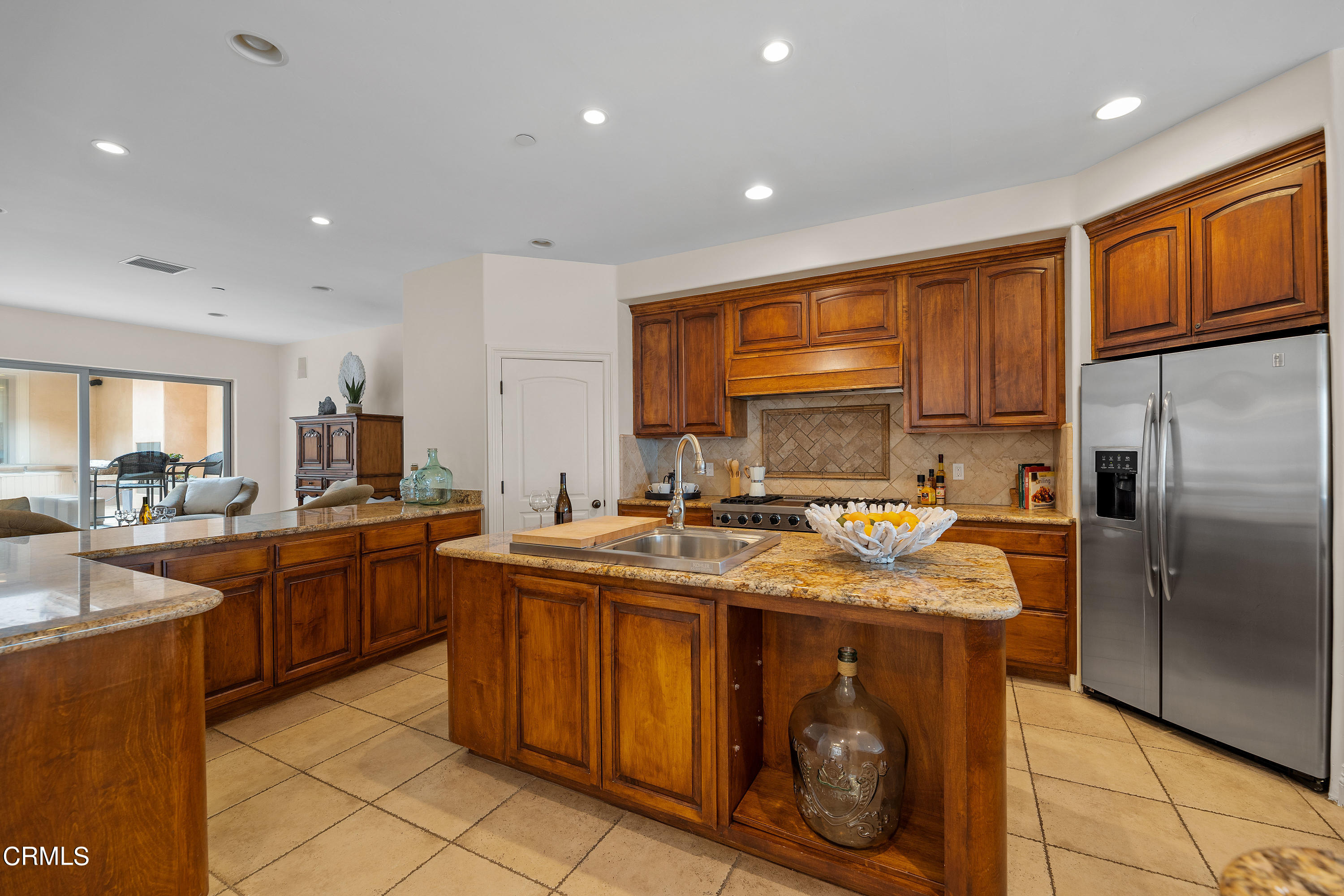 1065 Mandalay Beach Road Oxnard, CA 93035 - Photo 12 of 36 a kitchen with stainless steel appliances granite countertop a sink stove and refrigerator