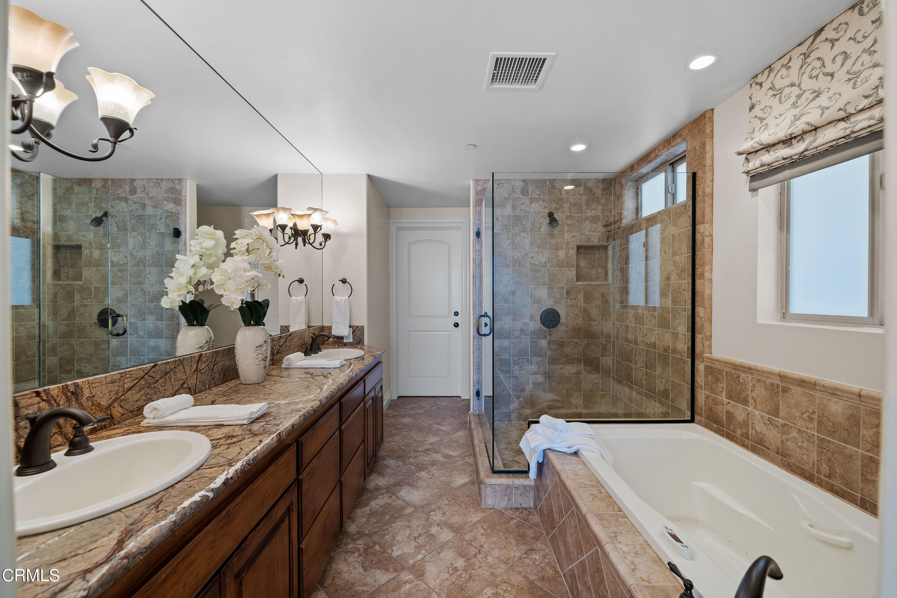 1065 Mandalay Beach Road Oxnard, CA 93035 - Photo 28 of 36 a bathroom with a double vanity sink mirror double and bathtub