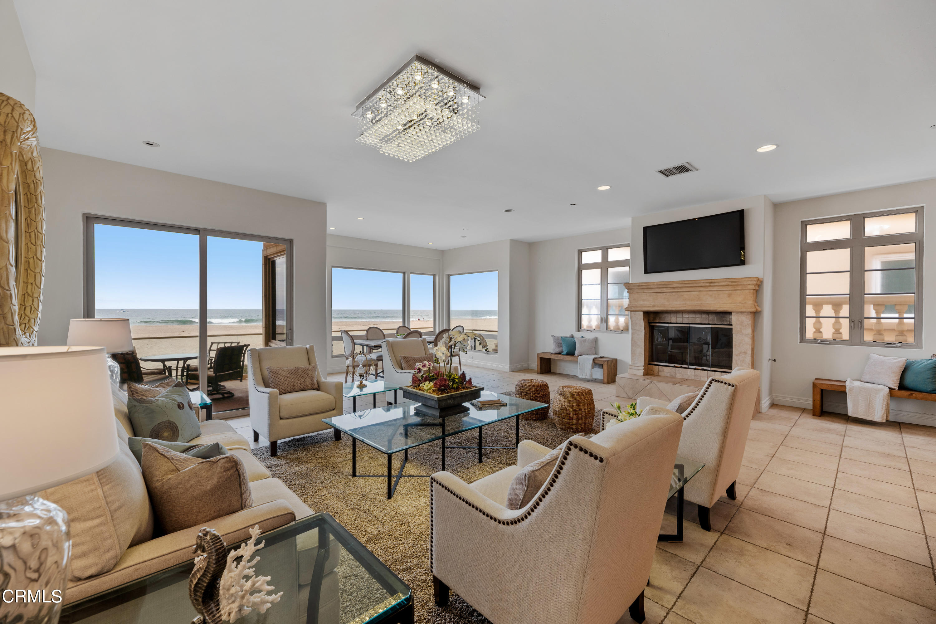 1065 Mandalay Beach Road Oxnard, CA 93035 - Photo 5 of 36 a living room with furniture fireplace and a flat screen tv