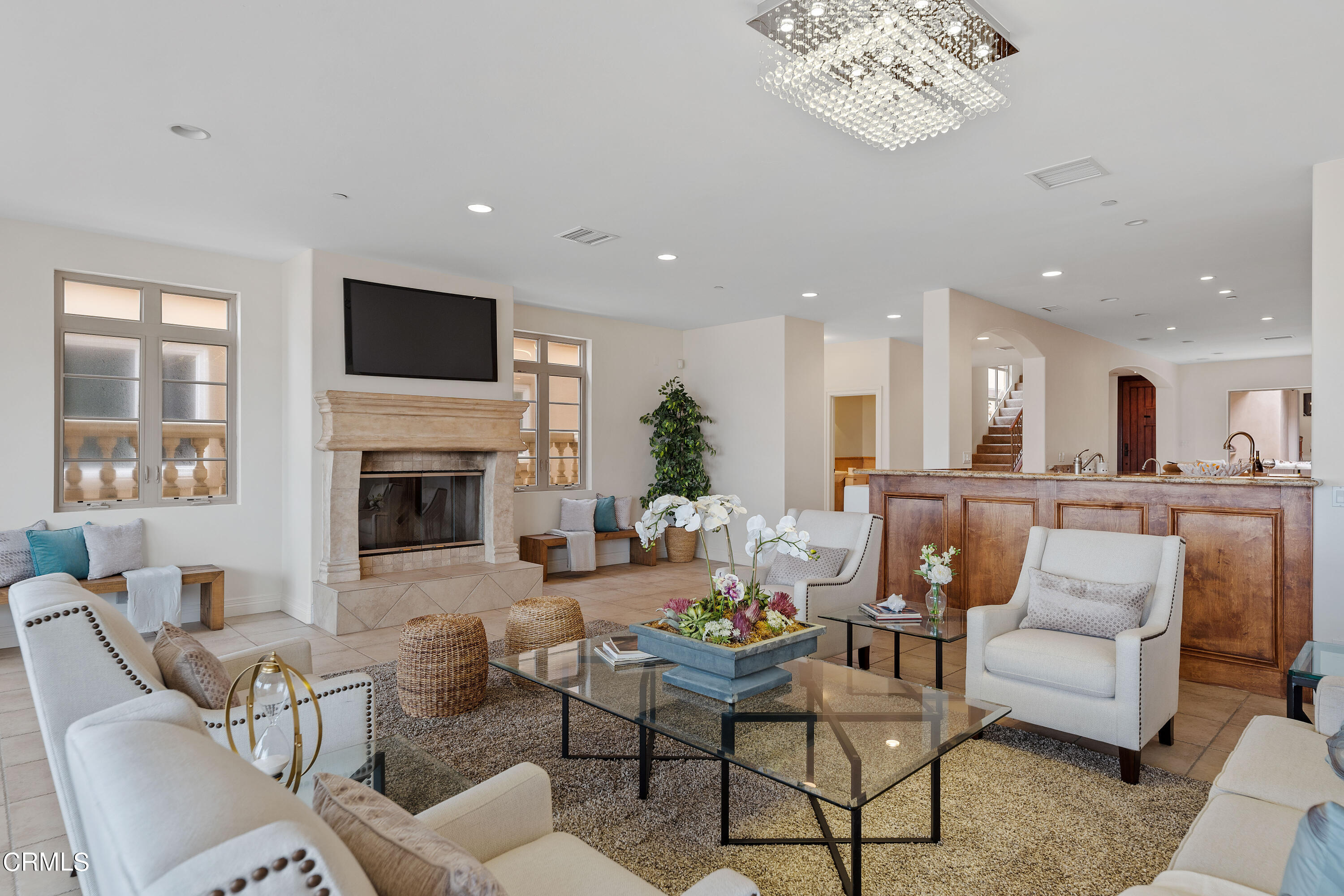 1065 Mandalay Beach Road Oxnard, CA 93035 - Photo 9 of 36 a living room with furniture a fireplace and a flat screen tv
