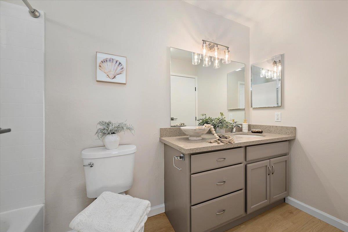 1093 Reed Avenue, Unit C Sunnyvale, CA 94086 - Photo 11 of 16 a bathroom with a toilet sink and mirror