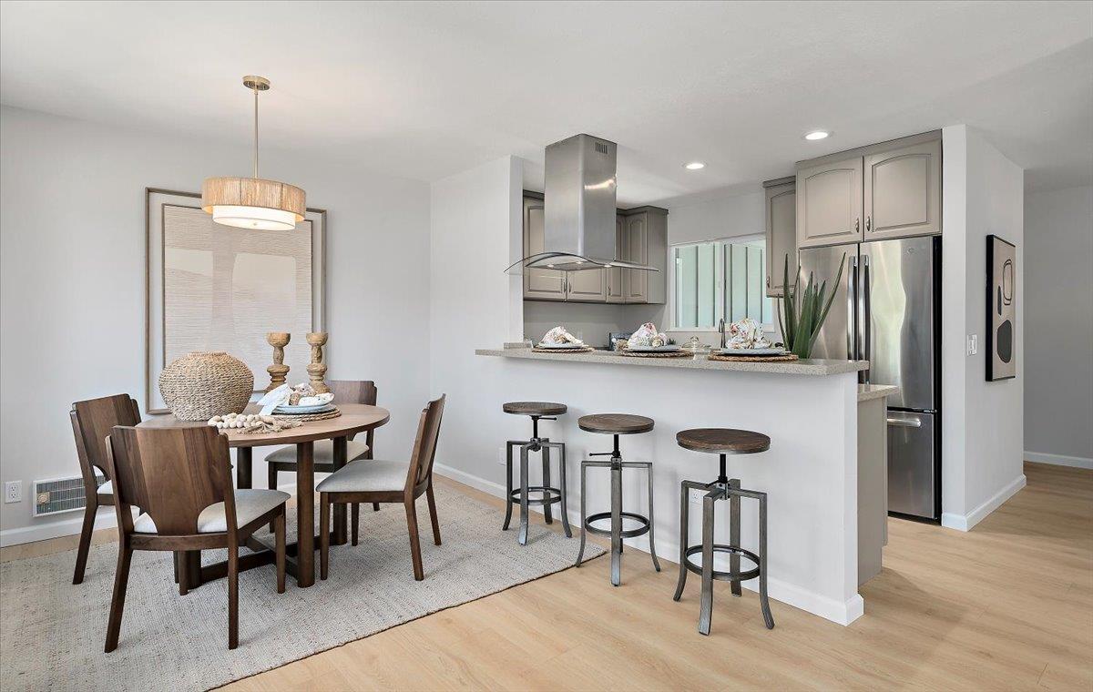 1093 Reed Avenue, Unit C Sunnyvale, CA 94086 - Photo 3 of 16 a view of a dining room with furniture window and wooden floor
