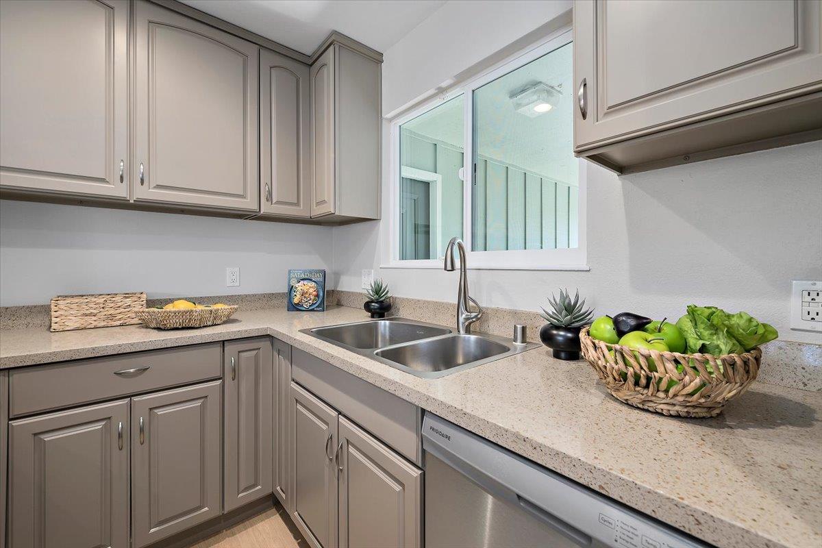 1093 Reed Avenue, Unit C Sunnyvale, CA 94086 - Photo 4 of 16 a kitchen with stainless steel appliances granite countertop a sink a stove and cabinets