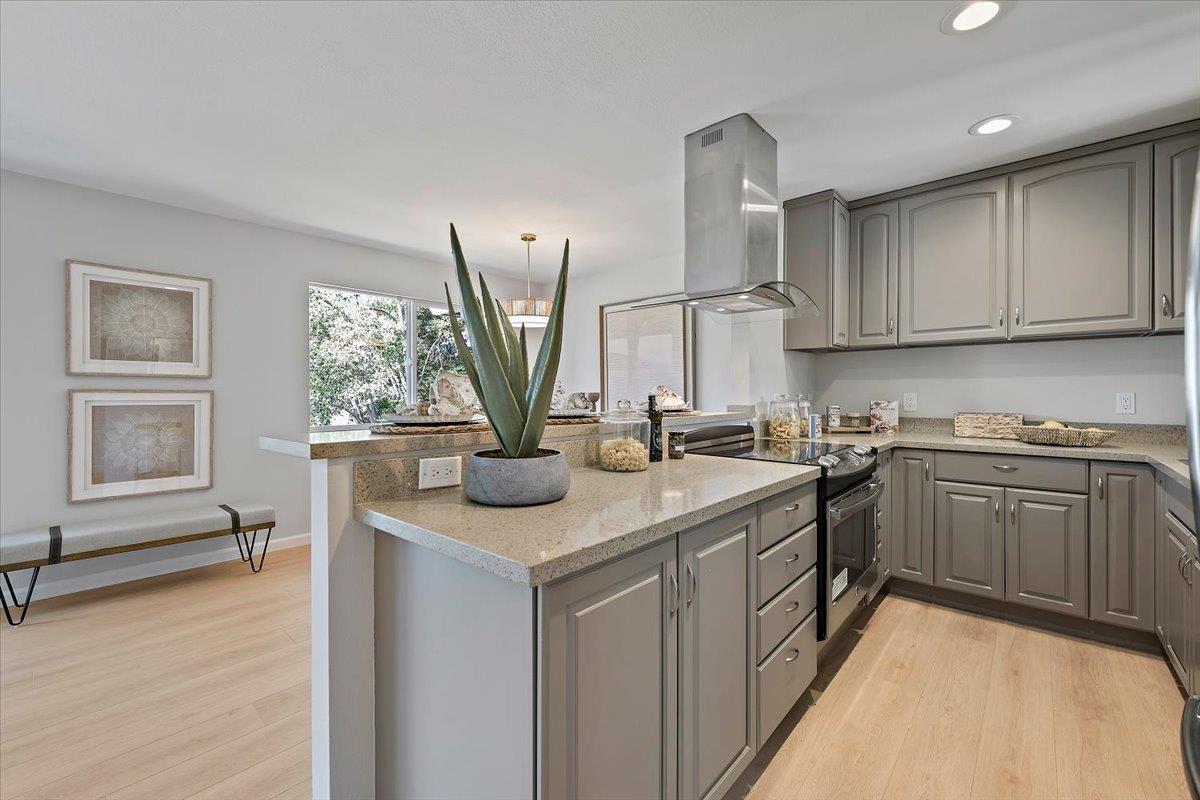 1093 Reed Avenue, Unit C Sunnyvale, CA 94086 - Photo 5 of 16 a kitchen with stainless steel appliances granite countertop a sink stove and cabinets