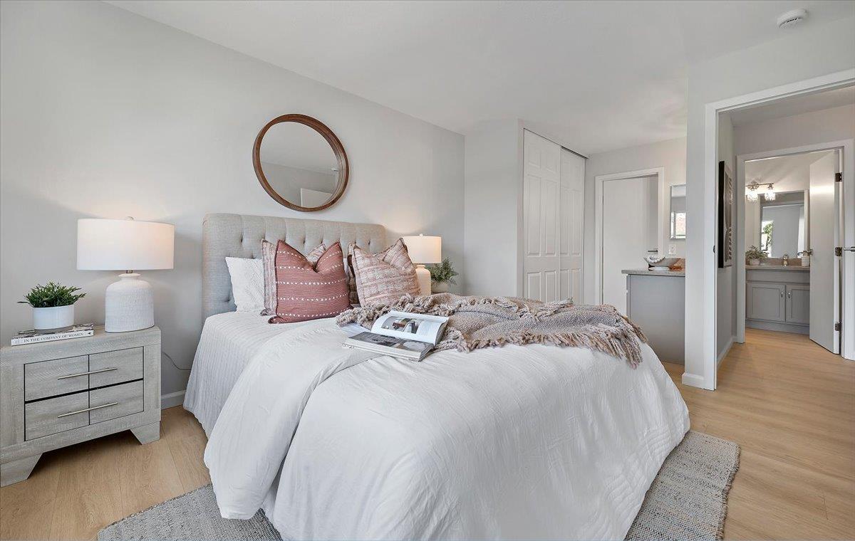 1093 Reed Avenue, Unit C Sunnyvale, CA 94086 - Photo 6 of 16 a bedroom with a bed and a lamp