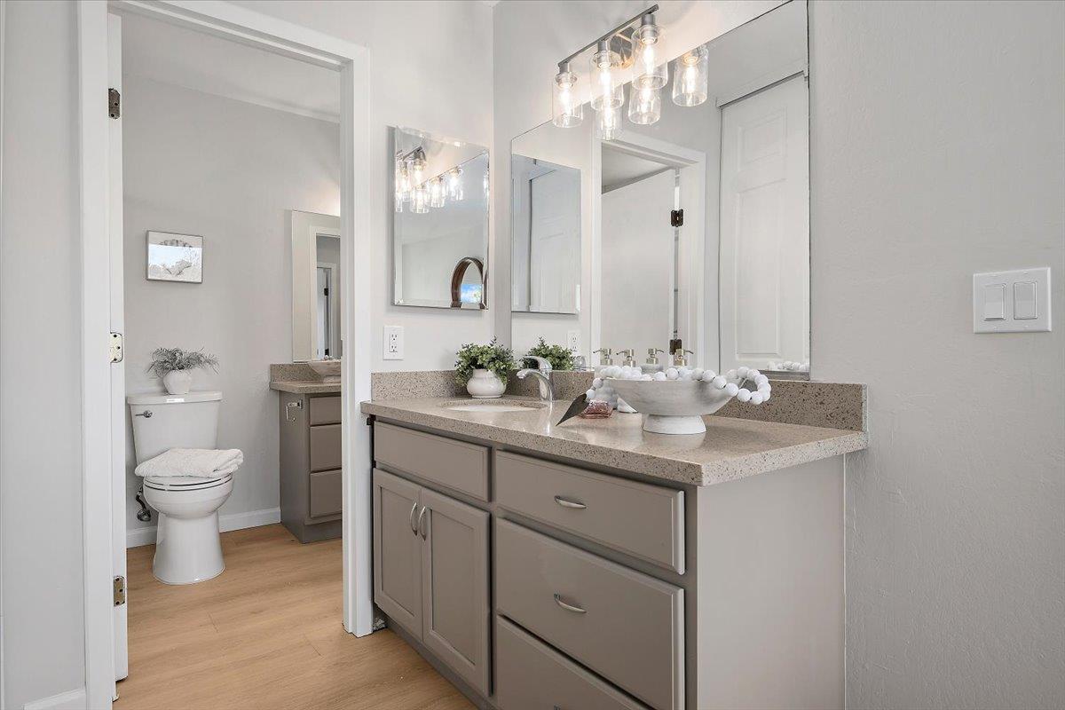 1093 Reed Avenue, Unit C Sunnyvale, CA 94086 - Photo 7 of 16 a bathroom with a toilet sink and mirror