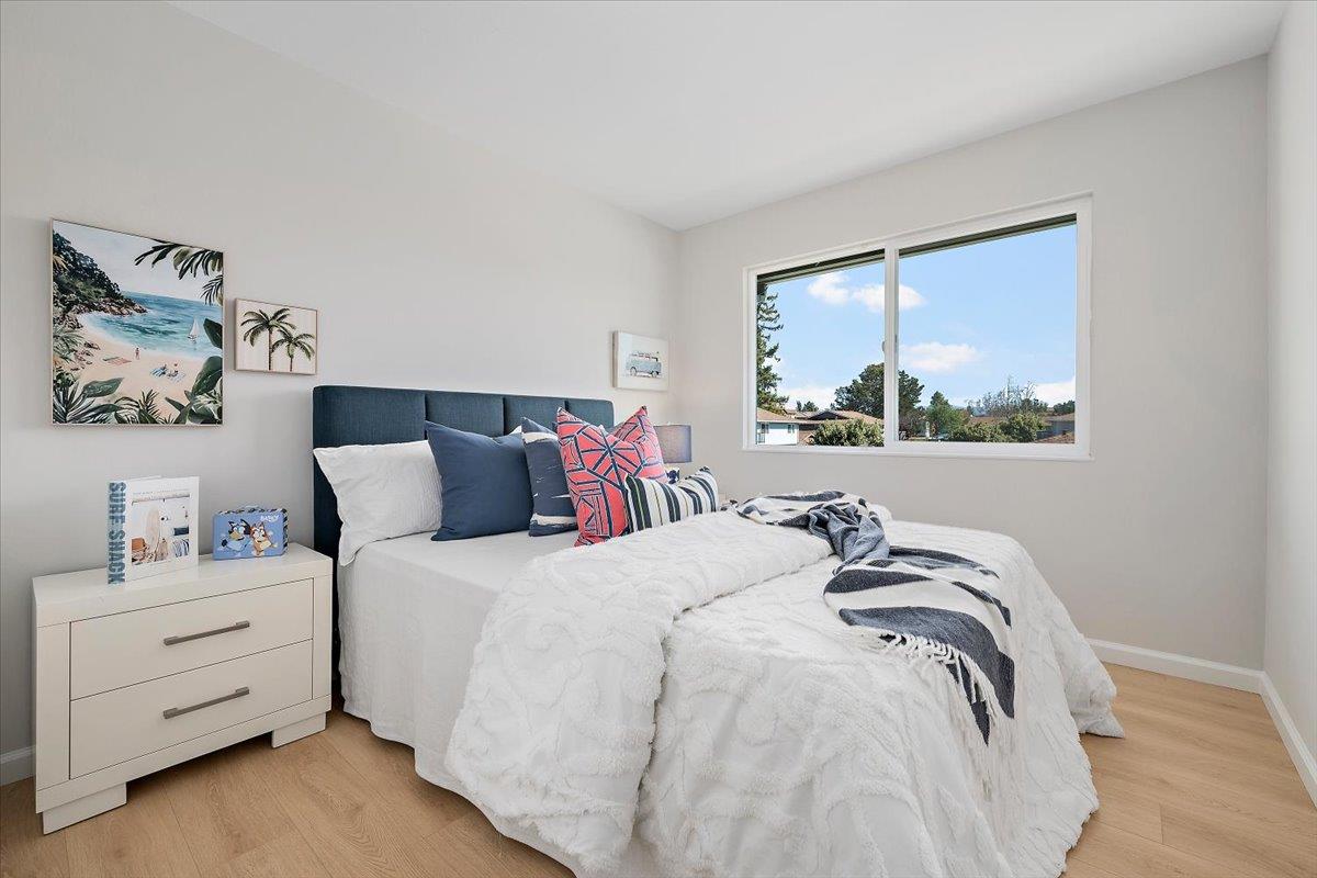 1093 Reed Avenue, Unit C Sunnyvale, CA 94086 - Photo 9 of 16 a bedroom with a bed and window