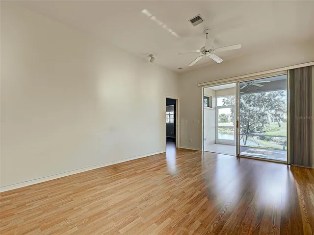 a kitchen with granite countertop a stove a sink and a microwave