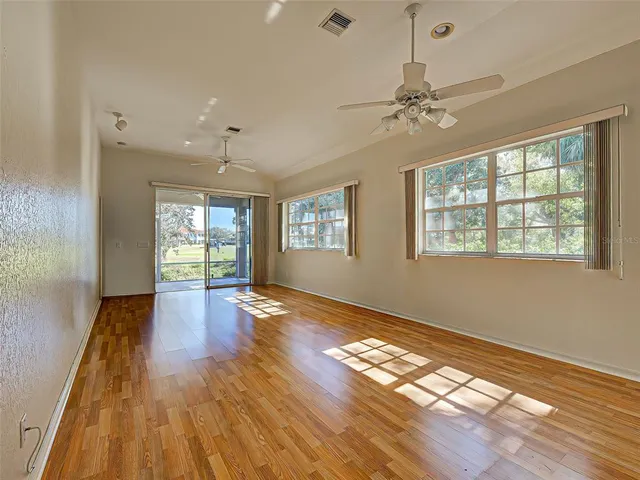 a living room with furniture and flat screen tv