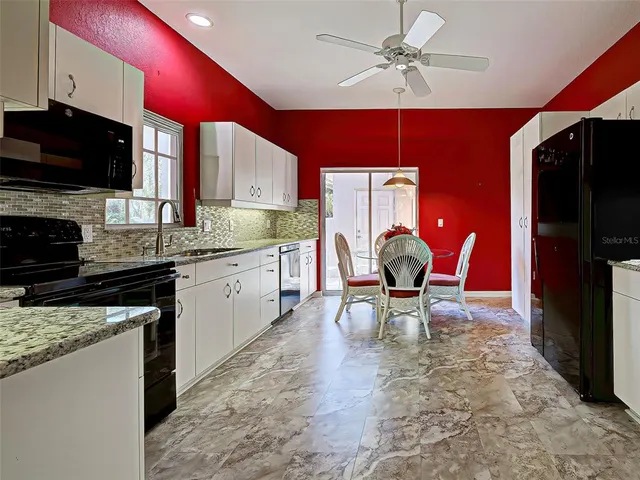 a bedroom with two beds and painted wall
