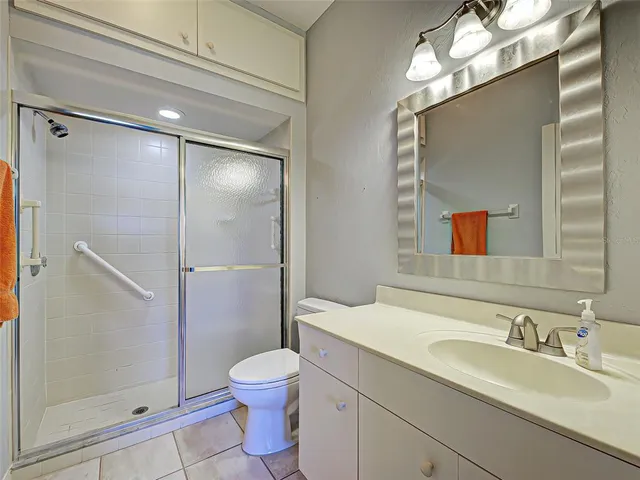 a view of a lake with houses in the back