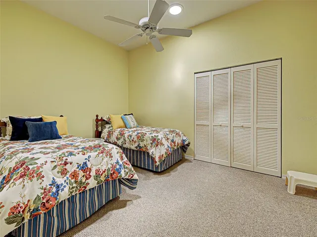 an aerial view of house with yard and lake view