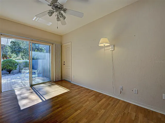 a view of a garden with a bench in the background