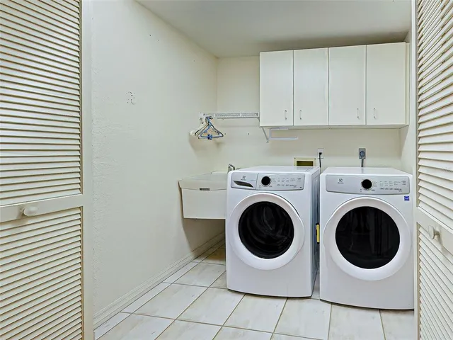 a view of a lake with houses in the back