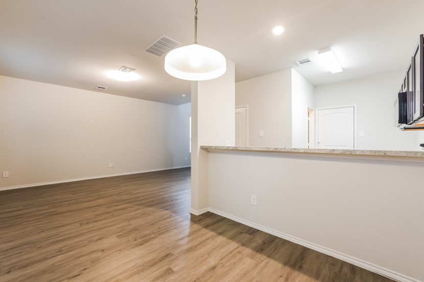 2618 Bouvardia Way Houston, TX 77073 - Photo 6 of 14 wooden floor in an empty room with a window