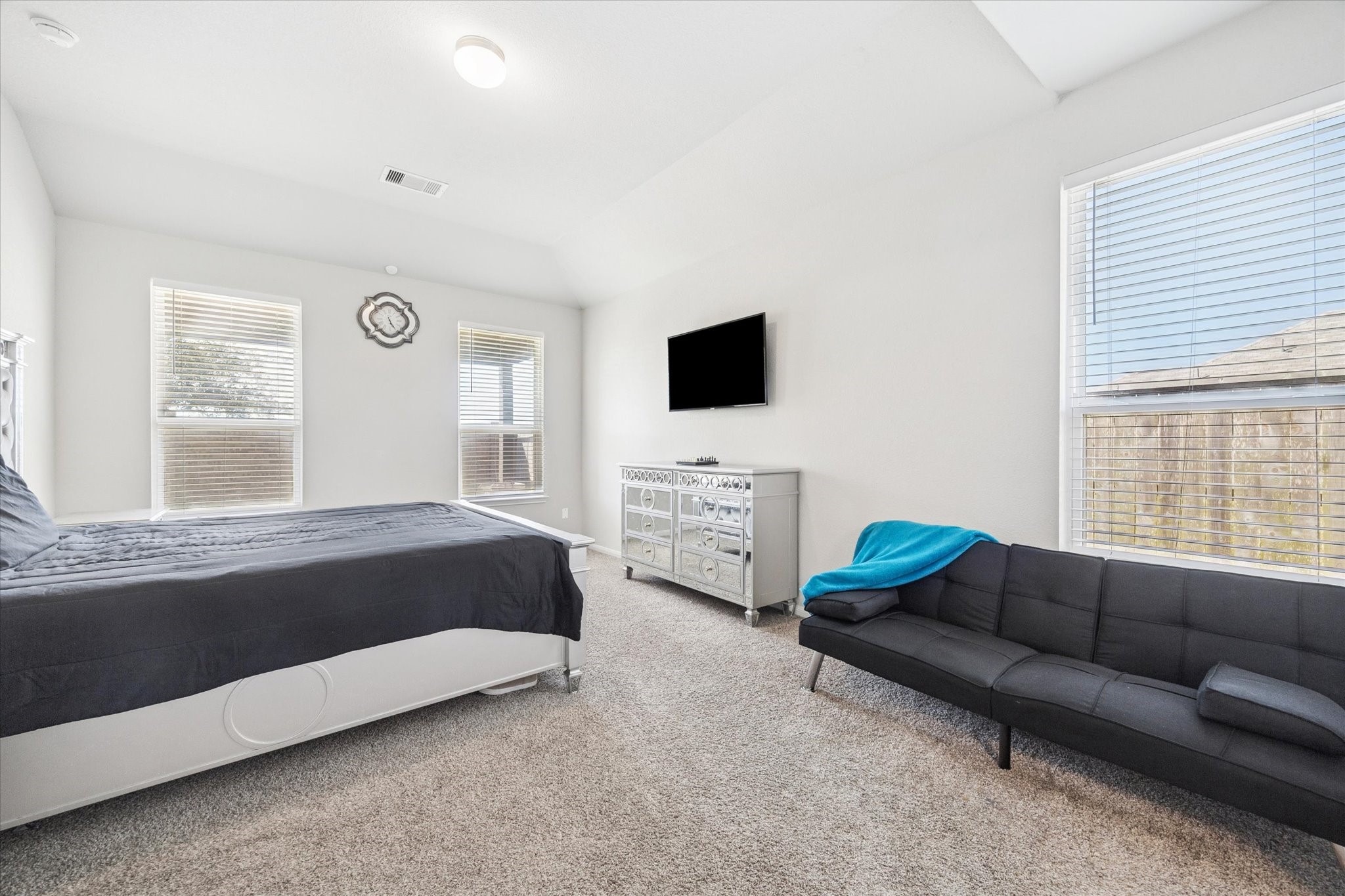 322 Upland Grv Trail Rosharon, TX 77583 - Photo 18 of 36 a bedroom with a bed a couch and a flat tv screen