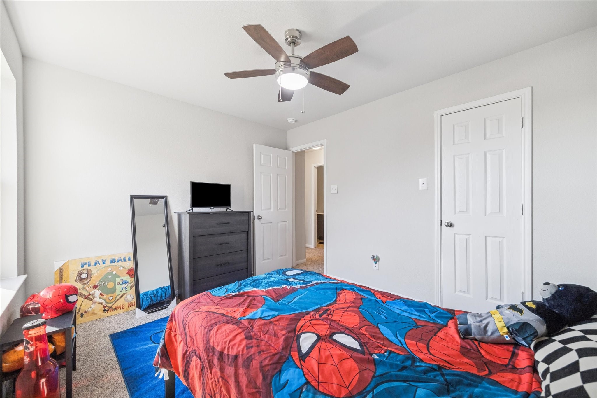 322 Upland Grv Trail Rosharon, TX 77583 - Photo 28 of 36 a bedroom with a bed and wooden floor