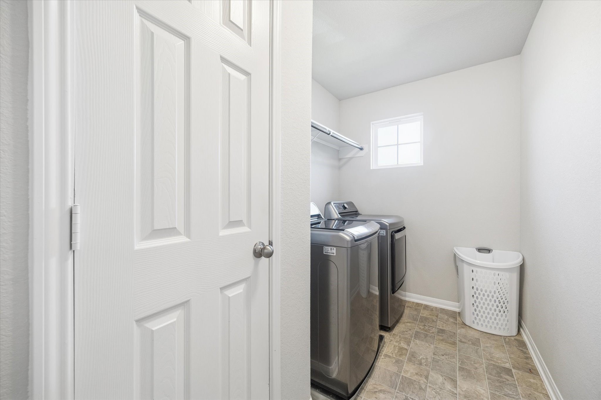 322 Upland Grv Trail Rosharon, TX 77583 - Photo 33 of 36 a view of a hallway with washer and dryer