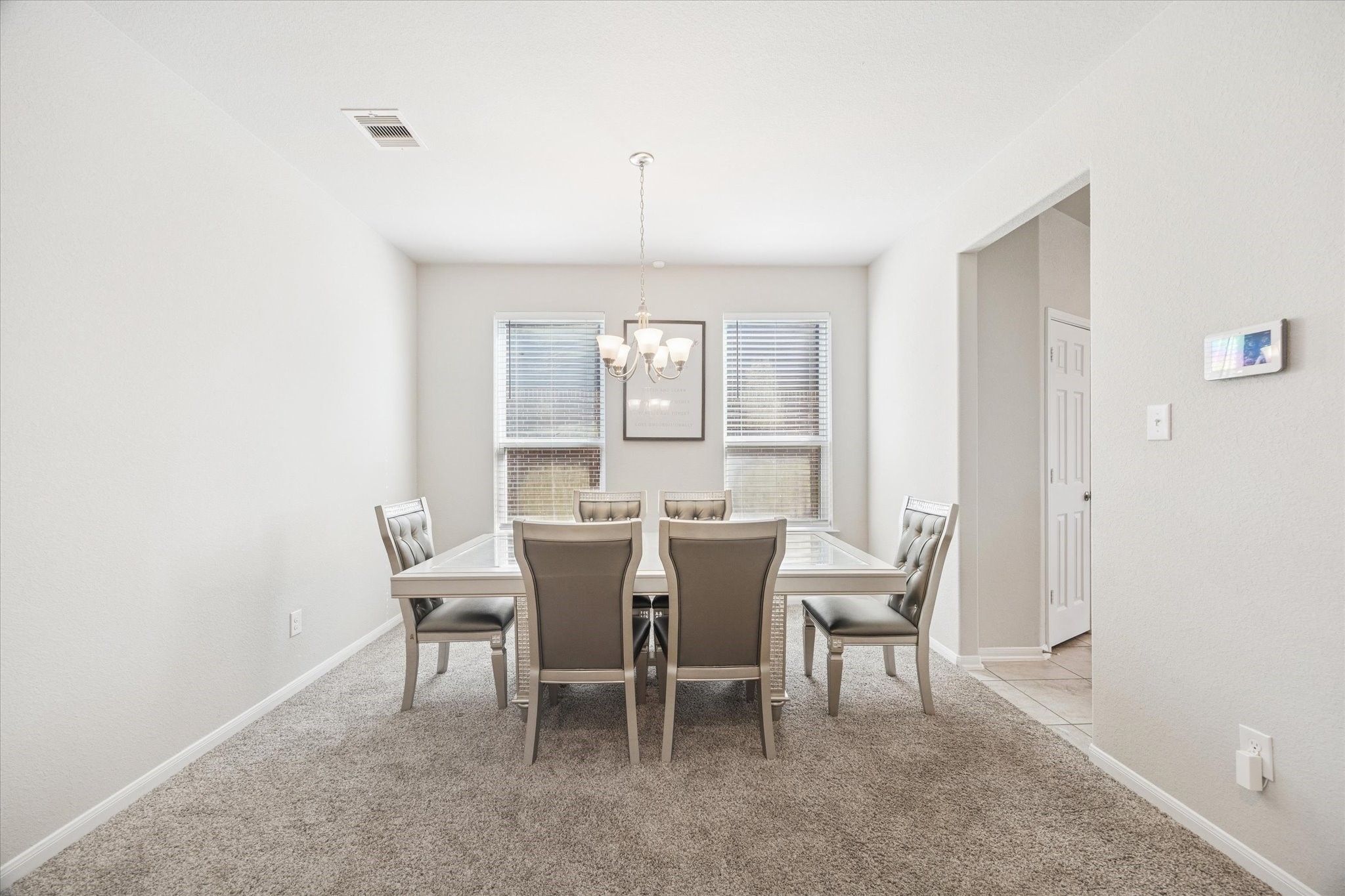 322 Upland Grv Trail Rosharon, TX 77583 - Photo 6 of 36 a view of a dining room with furniture and window