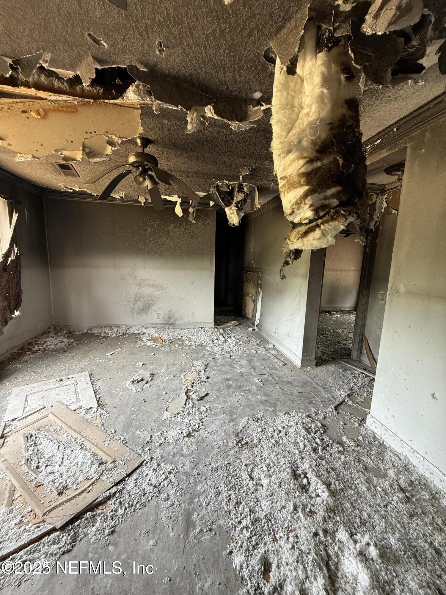 74 Conifer Circle Middleburg, FL 32068 - Photo 5 of 7 an empty room with a wooden floor