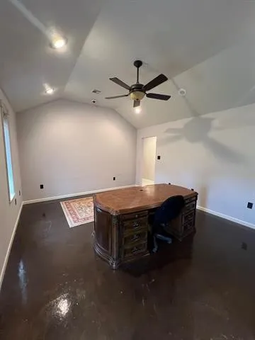 a room with furniture and a ceiling fan