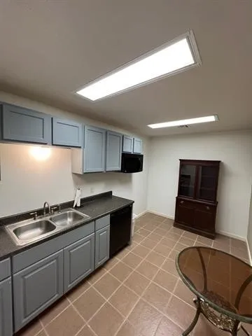 a kitchen with stainless steel appliances granite countertop a sink and a stove