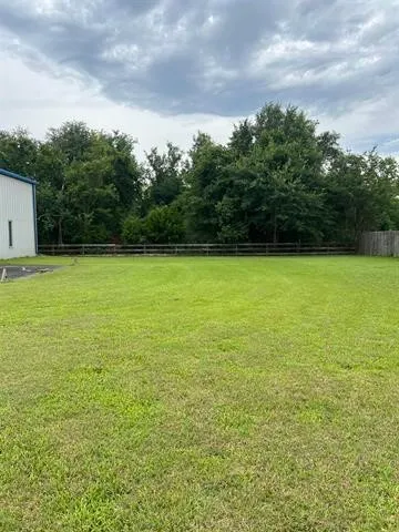 a view of a field with an outdoor space
