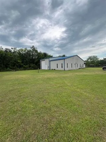 a view of a big room with an ocean and mountain view