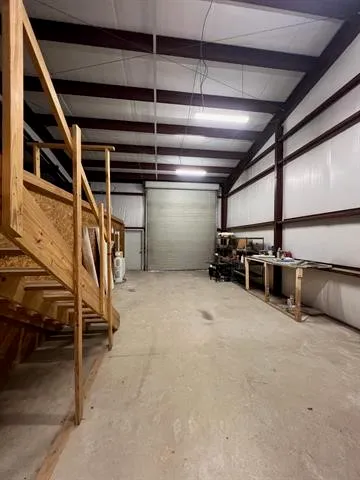 a view of an empty room with stairs