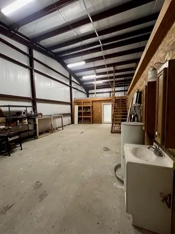 a utility room with multiple dryer and washer