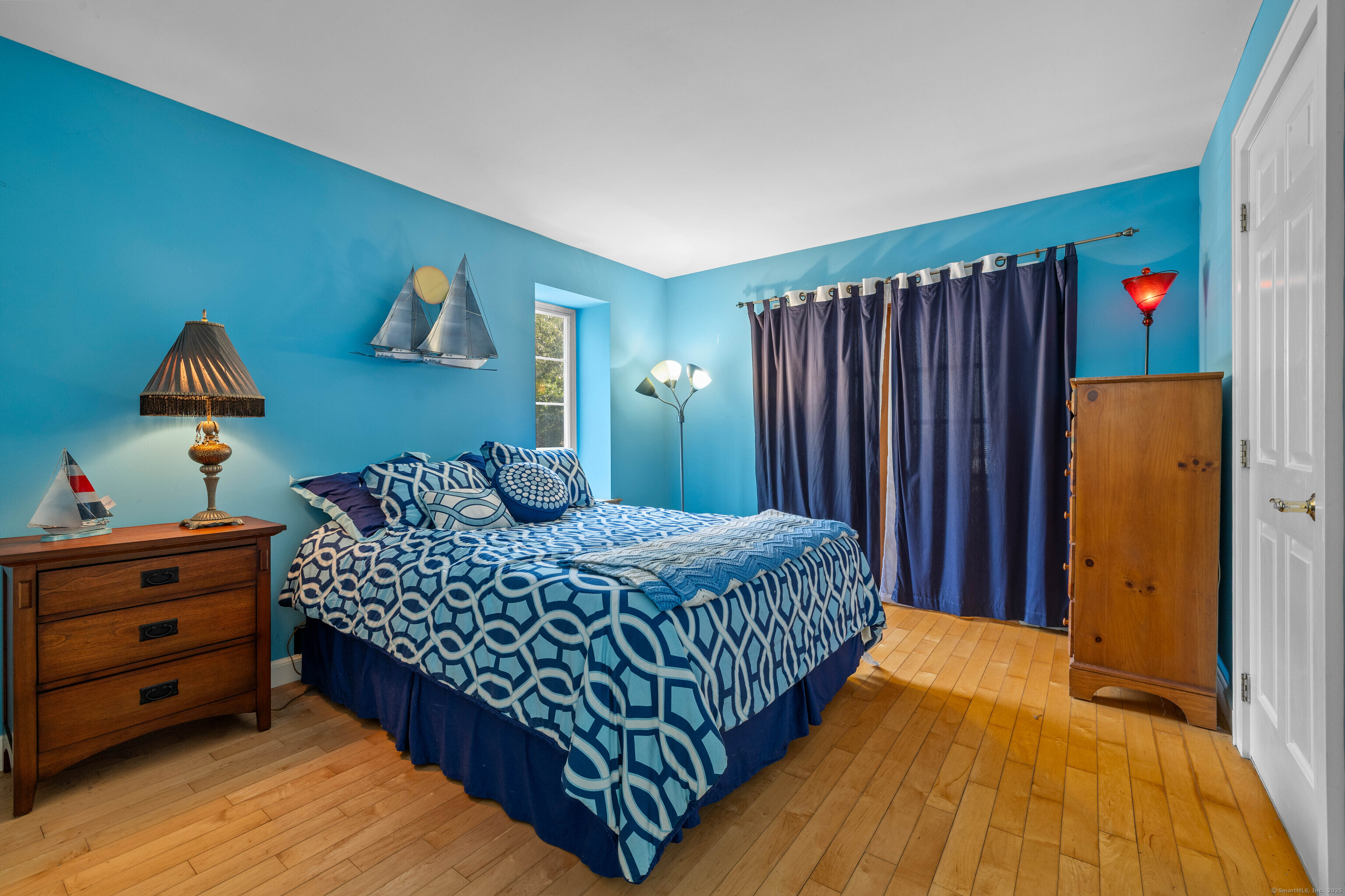 332 Lantern Hill Road Stonington, CT 06355 - Photo 21 of 38 a bedroom with a bed and a dresser