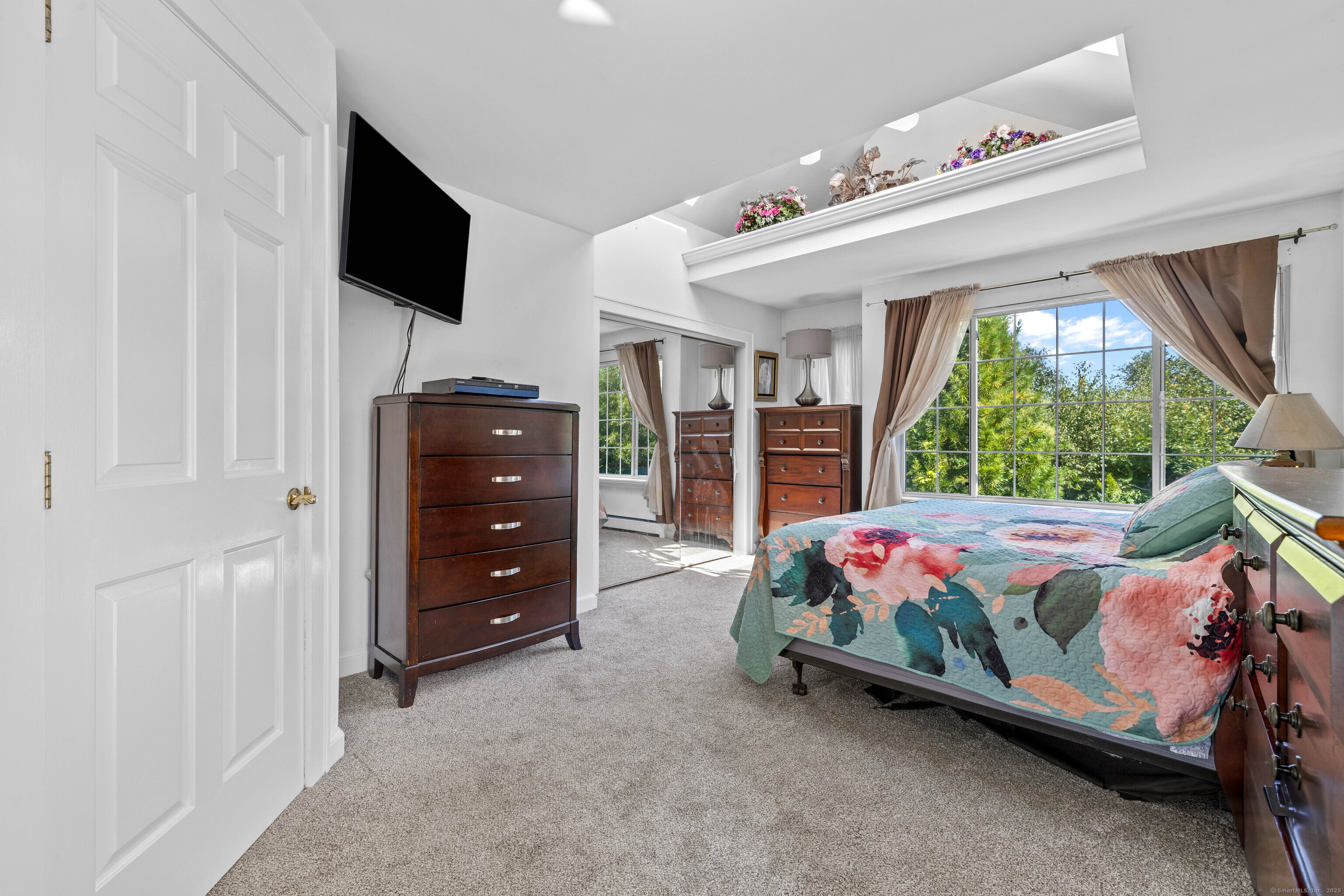 332 Lantern Hill Road Stonington, CT 06355 - Photo 26 of 38 a bedroom with a bed and a tv