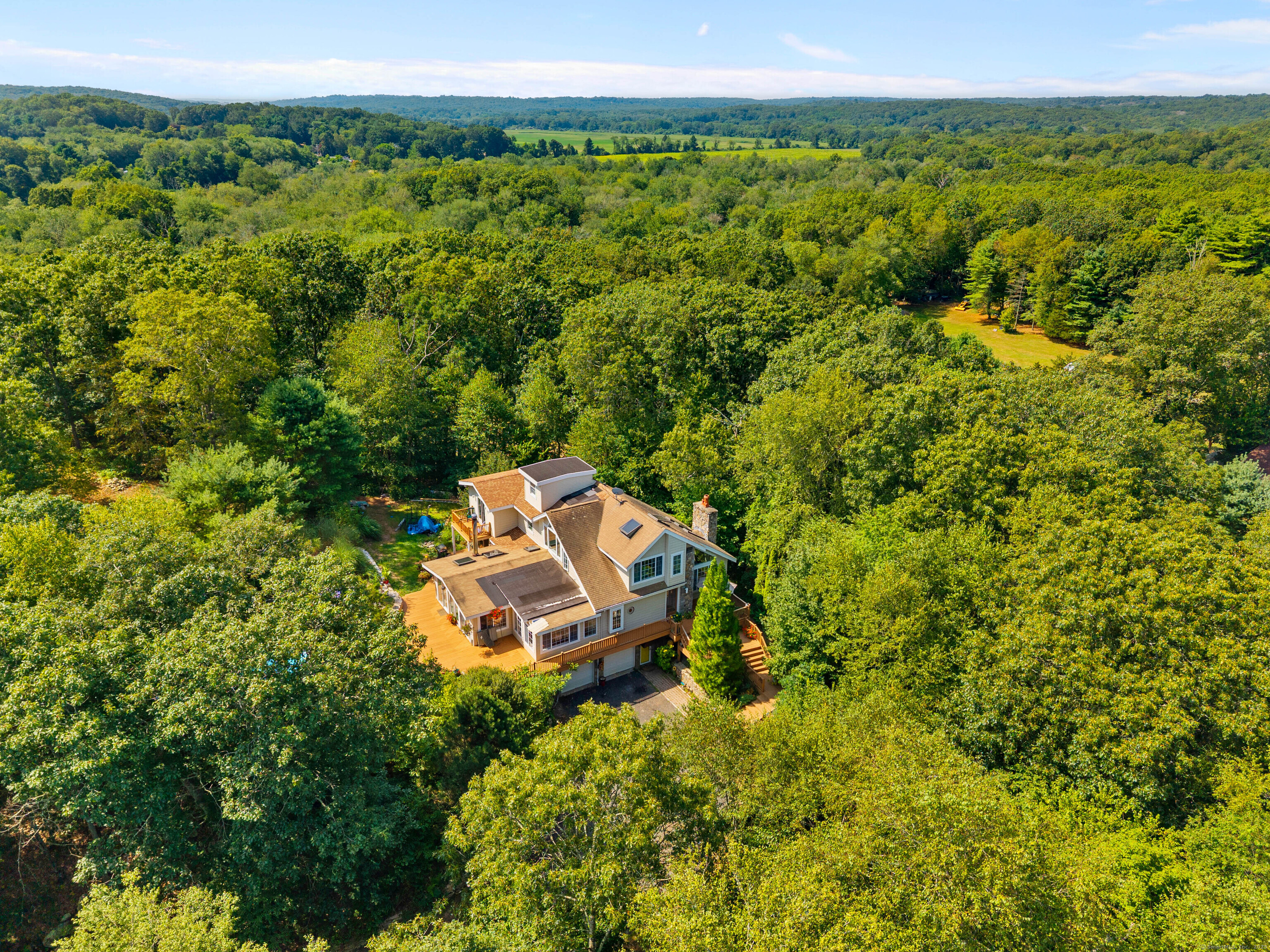 332 Lantern Hill Road Stonington, CT 06355 - Photo 35 of 38 an aerial view of a house with a yard