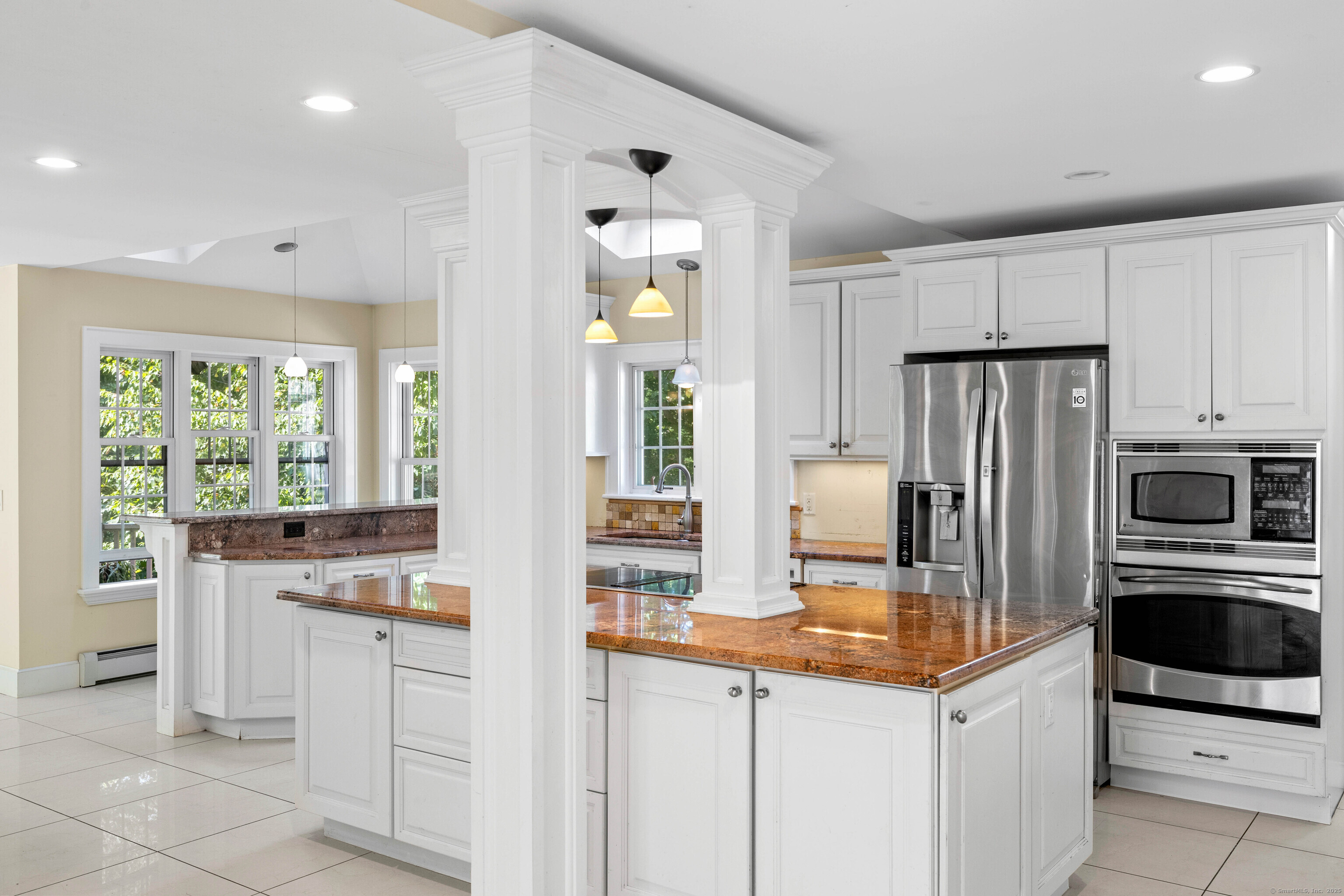 332 Lantern Hill Road Stonington, CT 06355 - Photo 9 of 38 a kitchen with granite countertop a sink stove and refrigerator