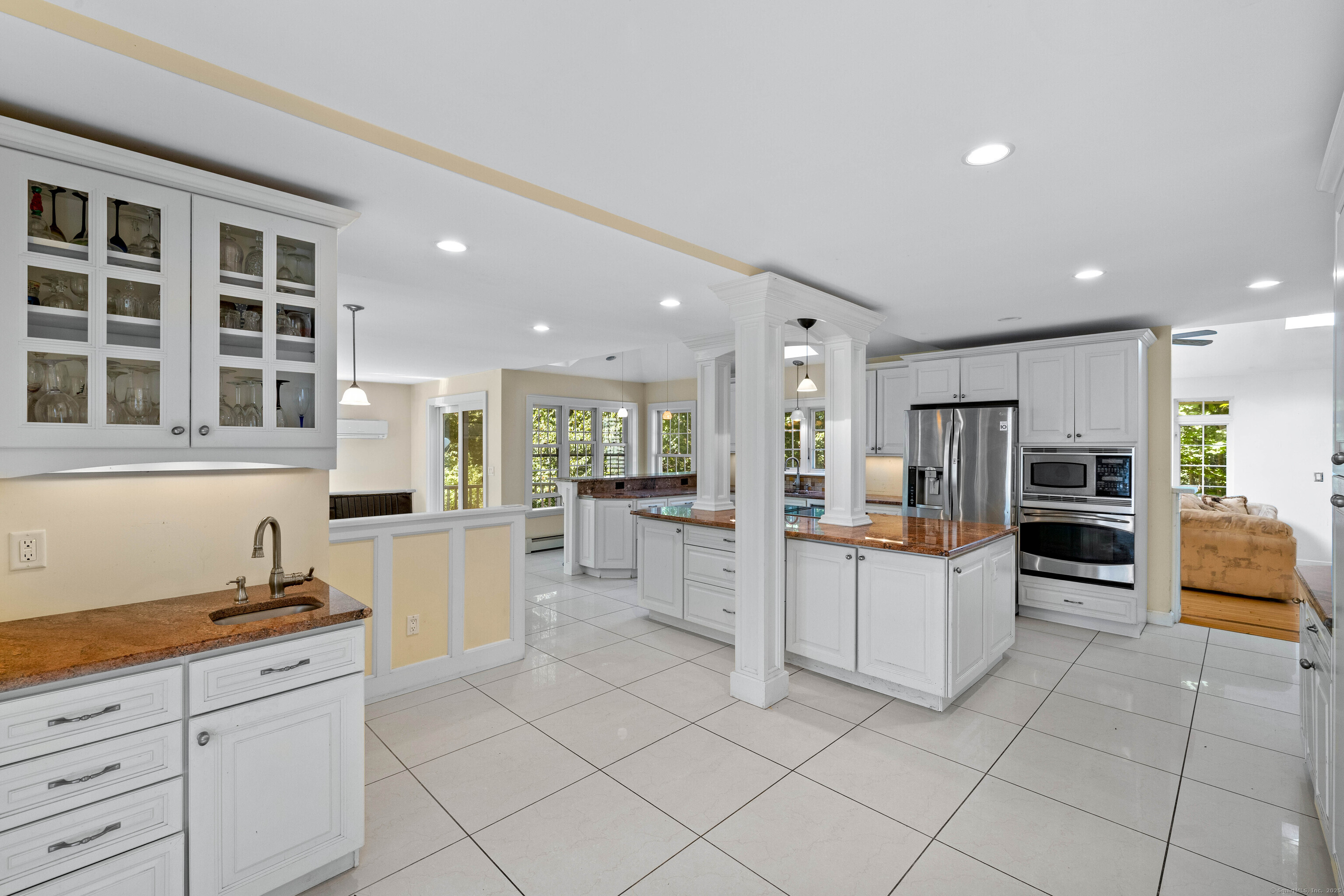 332 Lantern Hill Road Stonington, CT 06355 - Photo 10 of 38 a kitchen with white cabinets and refrigerator